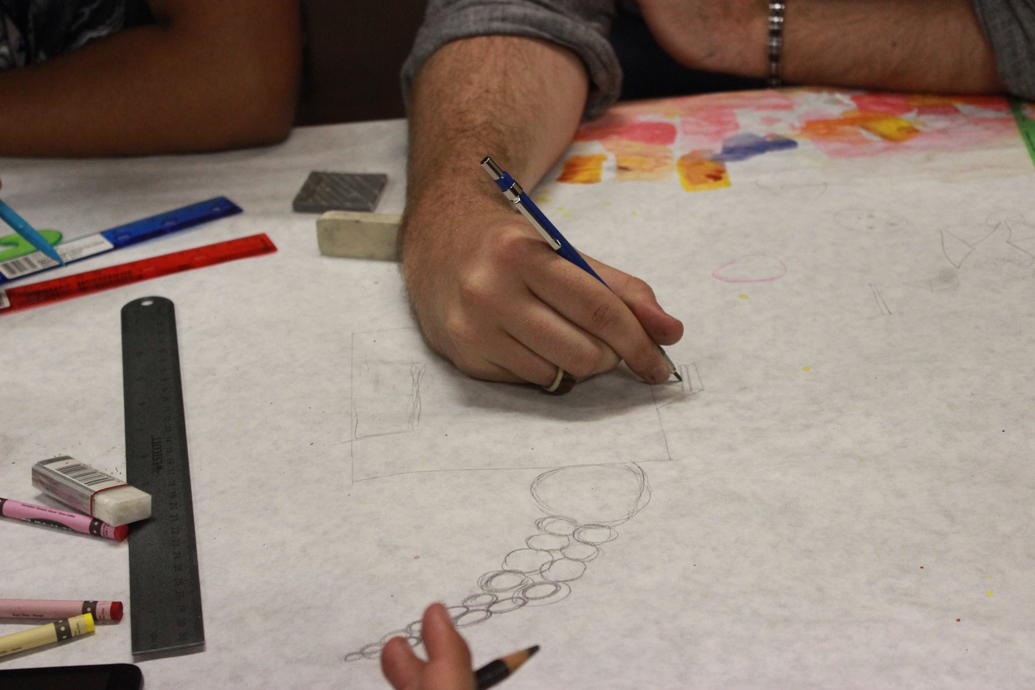 Participants Draw with Pencil Before Coloring Designs